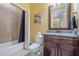 Inviting bathroom features a granite vanity, framed mirror, and tile shower at 2295 Falmouth Se Ct, Smyrna, GA 30080