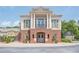 Beautiful clubhouse featuring a classic architectural style with brick and white column accents at 2295 Falmouth Se Ct, Smyrna, GA 30080