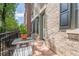 Outdoor deck area with a small table and chairs, perfect for relaxing outdoors at 2295 Falmouth Se Ct, Smyrna, GA 30080