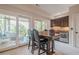 Basement dining area with sliding doors, built-in wet bar, and beverage fridge, perfect for entertaining at 2295 Falmouth Se Ct, Smyrna, GA 30080