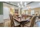 Charming dining area with decorative chandelier and access to the cozy living area at 2295 Falmouth Se Ct, Smyrna, GA 30080