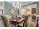 Open concept dining room adjacent to bar and living areas, with natural light at 2295 Falmouth Se Ct, Smyrna, GA 30080