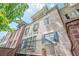 Brick townhome with a balcony and access to an outdoor brick patio at 2295 Falmouth Se Ct, Smyrna, GA 30080