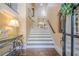 View of the foyer with wooden floors, stairs, and beautiful decor at 2295 Falmouth Se Ct, Smyrna, GA 30080