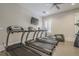 Well-equipped fitness center with treadmills, elliptical machines, and a wall-mounted television at 2295 Falmouth Se Ct, Smyrna, GA 30080
