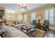 Elegant living room with hardwood floors, plantation shutters, and classic furnishings at 2295 Falmouth Se Ct, Smyrna, GA 30080