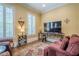 Inviting living room with natural light from plantation shutters, plush seating, and hardwood floors at 2295 Falmouth Se Ct, Smyrna, GA 30080