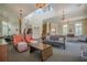 Comfortable lounge area with high ceilings, a central staircase and elevator, and stylish furnishings at 2295 Falmouth Se Ct, Smyrna, GA 30080
