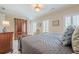 Main bedroom featuring a large bed, shutters and spacious interior at 2295 Falmouth Se Ct, Smyrna, GA 30080