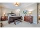 Bedroom with luxurious bed and bench and matching side tables and lamps at 2295 Falmouth Se Ct, Smyrna, GA 30080