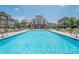 A beautiful pool featuring lounge chairs surrounded by upscale townhomes in a community setting at 2295 Falmouth Se Ct, Smyrna, GA 30080