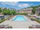 Resort-style pool surrounded by lounge chairs and well-maintained landscaping in a gated community at 2295 Falmouth Se Ct, Smyrna, GA 30080