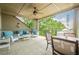 Inviting porch with stylish seating, ceiling fan, columns, and outdoor dining at 2295 Falmouth Se Ct, Smyrna, GA 30080