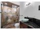 Modern bathroom featuring granite countertop and tile shower with rainfall showerhead at 3301 Chastain Ridge Dr, Marietta, GA 30066