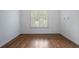 Bedroom features hardwood floors, plantation shutters, and recessed lights at 3301 Chastain Ridge Dr, Marietta, GA 30066