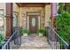 Inviting entryway features a stone walkway, covered porch, and a decorative front door at 3301 Chastain Ridge Dr, Marietta, GA 30066