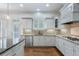 Stylish kitchen with white cabinets, granite countertops, stainless steel appliances, and a view of the outdoor area at 3301 Chastain Ridge Dr, Marietta, GA 30066