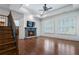 Living room featuring fireplace, flat screen TV, hardwood floors, and plantation shutters at 3301 Chastain Ridge Dr, Marietta, GA 30066
