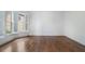 Spacious room with hardwood floors, white trim, and plantation shutters at 3301 Chastain Ridge Dr, Marietta, GA 30066