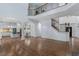 A spacious living room featuring hardwood floors, an open floor plan, staircase, and architectural details at 3301 Chastain Ridge Dr, Marietta, GA 30066