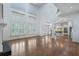 Bright living room with hardwood floors, a fireplace, and large windows with plantation shutters at 3301 Chastain Ridge Dr, Marietta, GA 30066