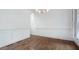 Spacious living area with hardwood floors, wainscoting, and an elegant chandelier at 3301 Chastain Ridge Dr, Marietta, GA 30066