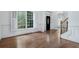 Bright living room with hardwood floors, white trim, and large windows with plantation shutters at 3301 Chastain Ridge Dr, Marietta, GA 30066