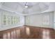 Bright main bedroom featuring hardwood floors, trey ceiling and multiple windows providing ample natural light at 3301 Chastain Ridge Dr, Marietta, GA 30066