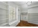 This walk-in closet has hardwood floors and is illuminated by natural light at 3301 Chastain Ridge Dr, Marietta, GA 30066