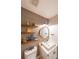 Chic half-bathroom featuring wood plank walls and floating shelves at 4135 Creekwood Dr, Cumming, GA 30041