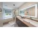 Modern bathroom featuring double sinks, a glass shower, and a large mirror at 4135 Creekwood Dr, Cumming, GA 30041