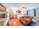 Bright bedroom featuring a ceiling fan, sitting area, and hardwood floors at 4135 Creekwood Dr, Cumming, GA 30041