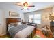 Comfortable bedroom featuring a ceiling fan and hardwood floors at 4135 Creekwood Dr, Cumming, GA 30041