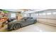 Clean garage featuring a parked car and storage cabinets at 4135 Creekwood Dr, Cumming, GA 30041