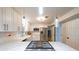 Bright kitchen with stainless steel appliances, white cabinets, quartz countertops, and modern pendant lighting at 4135 Creekwood Dr, Cumming, GA 30041