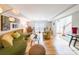 Spacious living room with hardwood floors, modern lighting and ample seating at 4135 Creekwood Dr, Cumming, GA 30041