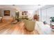 Large living room with hardwood floors and recessed lighting offers ample natural light at 4135 Creekwood Dr, Cumming, GA 30041