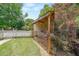 Cozy shed in backyard with a white picket fence, perfect for storage or a workshop at 4135 Creekwood Dr, Cumming, GA 30041