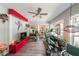 Bright sunroom with views of trees with a ceiling fan and lots of light at 4135 Creekwood Dr, Cumming, GA 30041