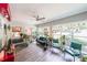 Light-filled sunroom with hardwood floors and multiple windows offers a relaxing space at 4135 Creekwood Dr, Cumming, GA 30041