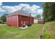Spacious backyard featuring a patio, grill, storage shed, and well-manicured lawn at 4549 Clarks Creek Ter, Ellenwood, GA 30294