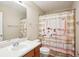Cozy bathroom featuring a vanity with a white sink and decorative shower curtain at 4549 Clarks Creek Ter, Ellenwood, GA 30294