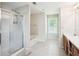 Bright bathroom featuring a soaking tub and a separate shower with glass enclosure at 4549 Clarks Creek Ter, Ellenwood, GA 30294