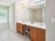 Bathroom featuring double sinks, a large mirror, and decorative lighting at 4549 Clarks Creek Ter, Ellenwood, GA 30294