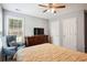 Serene bedroom featuring a dresser, an armchair, and natural light at 4549 Clarks Creek Ter, Ellenwood, GA 30294