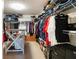 Walk-in closet with ample shelving and hanging space for clothes and accessories at 4549 Clarks Creek Ter, Ellenwood, GA 30294