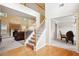 Grand foyer with hardwood floors, staircase, and views into the living and dining areas at 4549 Clarks Creek Ter, Ellenwood, GA 30294