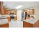 Kitchen featuring wooden cabinets and stainless steel appliances with ample counter space at 4549 Clarks Creek Ter, Ellenwood, GA 30294