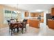 Bright kitchen features an island and a breakfast table near a large window at 4549 Clarks Creek Ter, Ellenwood, GA 30294
