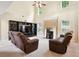 Inviting living room with a fireplace, media center, and plenty of natural light at 4549 Clarks Creek Ter, Ellenwood, GA 30294